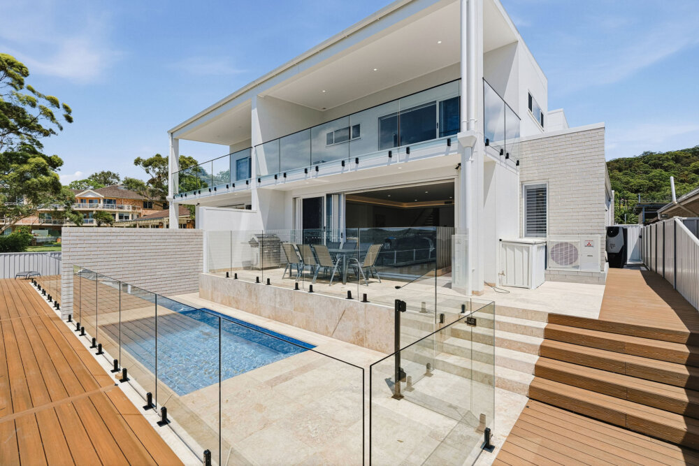Serene, a luxury 4-bed waterfront home in Point Clare with pool, spa, boat ramp & stunning views. Sleeps 10. The ultimate Central Coast escape. Book now!